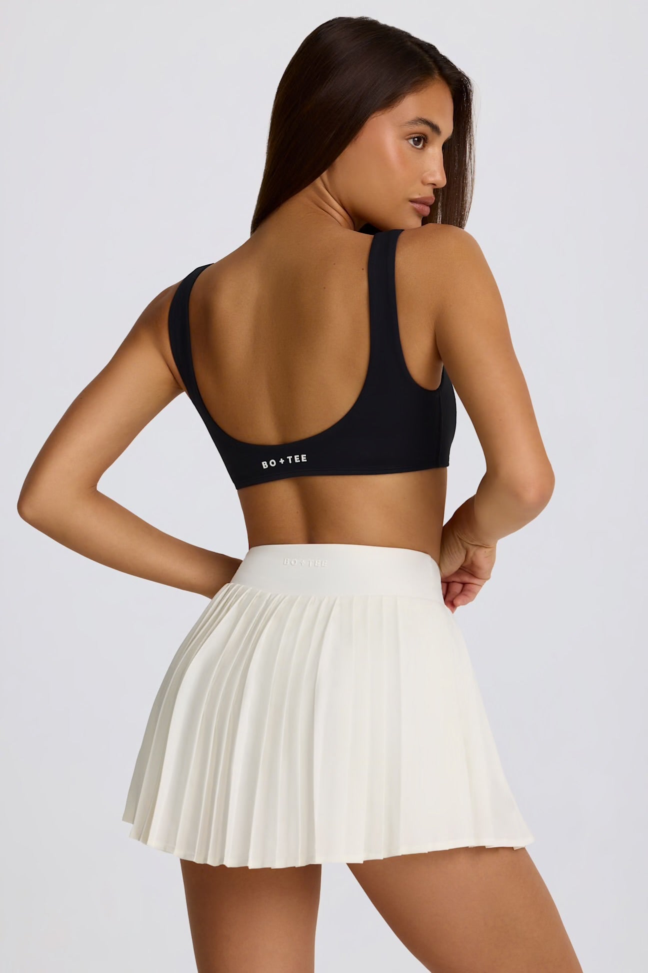 Soft Active Crossover Pleated Mini Skort